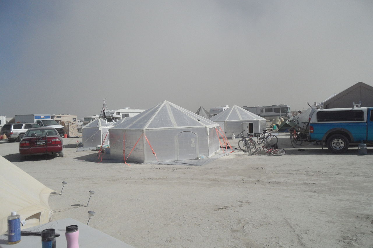 The meme is a screenshot of a Reddit comment, where a user is complaining about the lack of amenities in the Burning Man festival. The text reads: "I've been here for 3 days and still no shower. Is this a joke?"